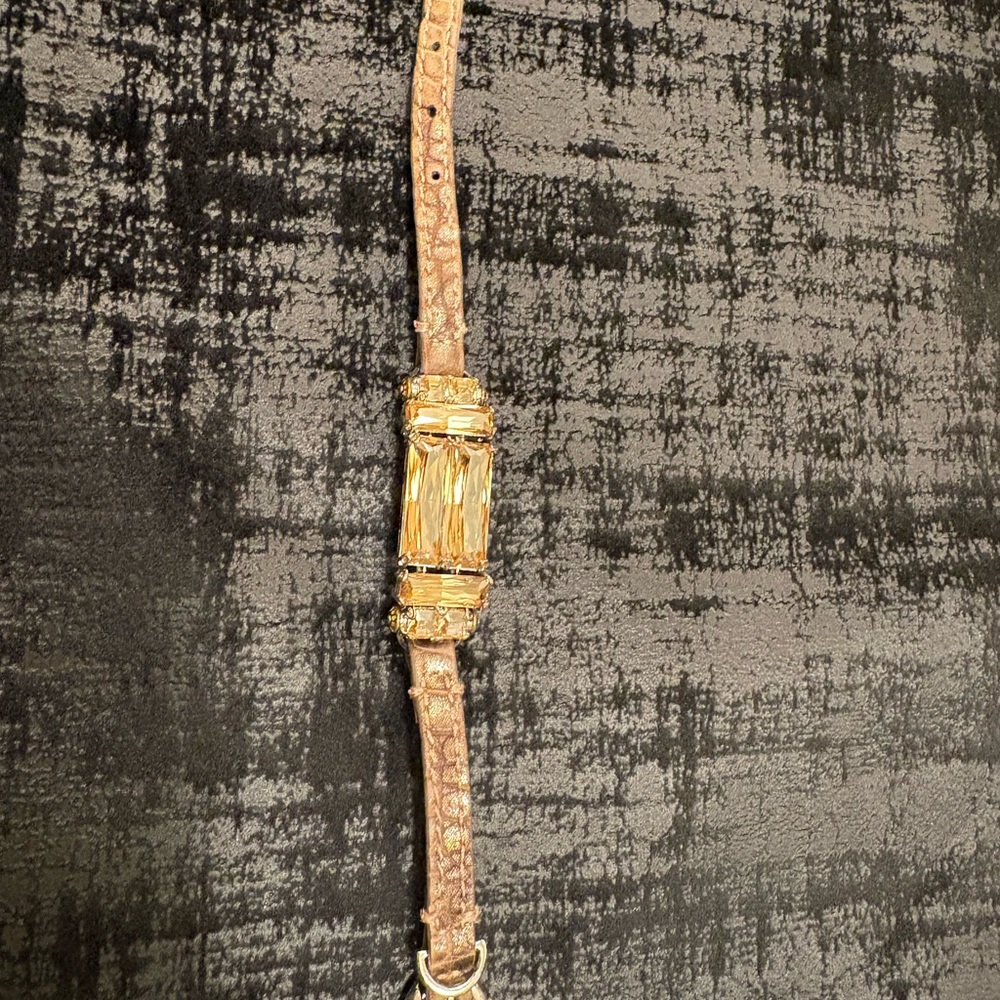 Henri bendel gold and brown bracelet with Textured Strap. Amber color stone.